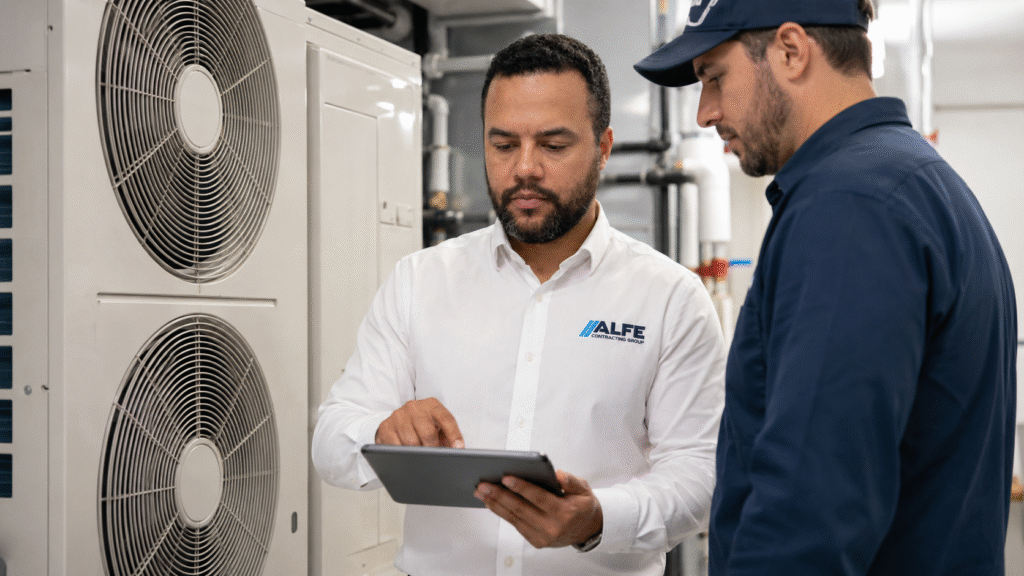 Certified Alfe Construction technician installing a new air conditioning unit at a residential home in Orlando, Central Florida