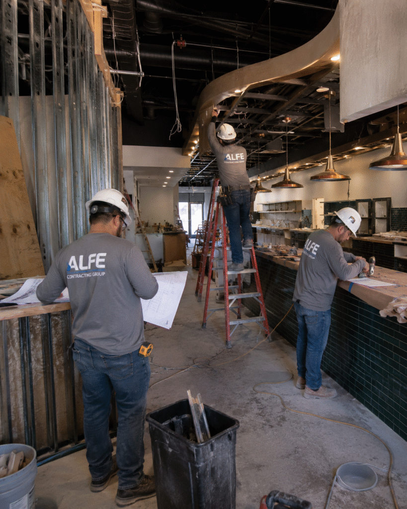 Alfe Construction team completing a custom restaurant build-out project in Orlando, Central Florida