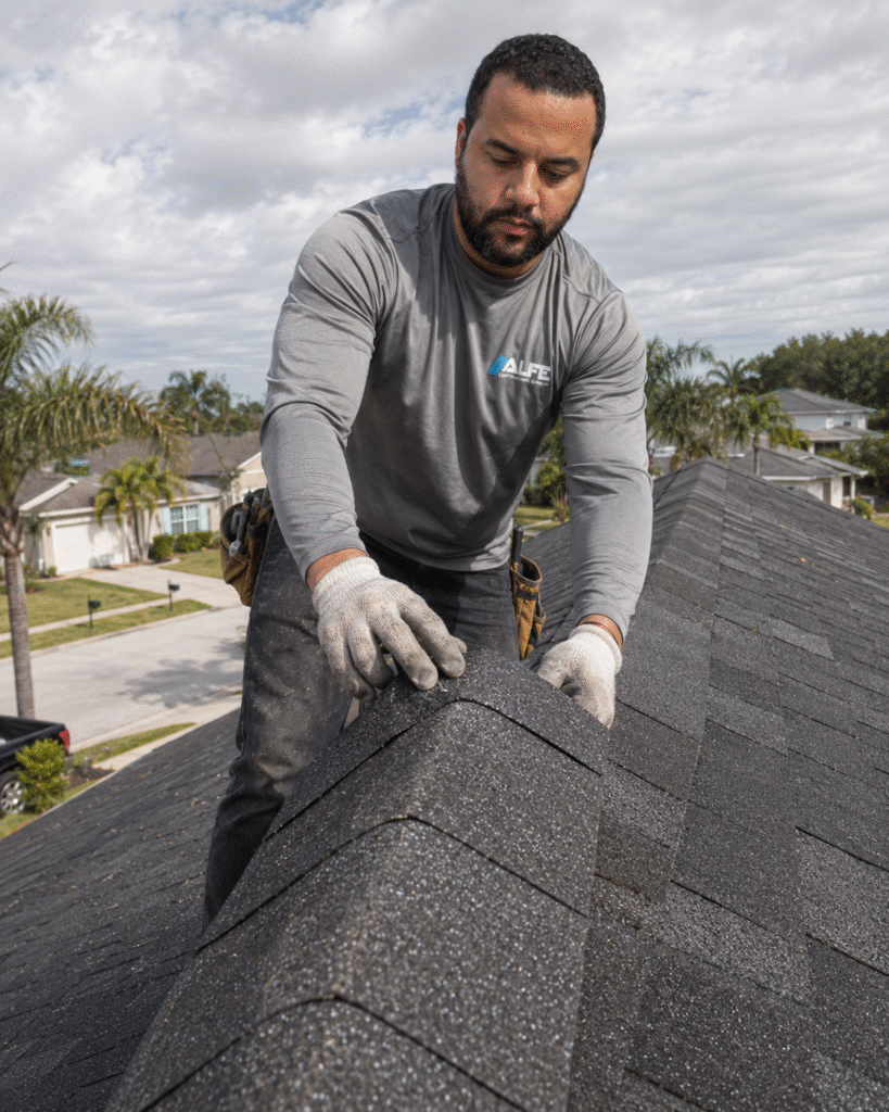Alfe Construction contractor repairing a damaged roof on a residential home in Orlando, Central Florida