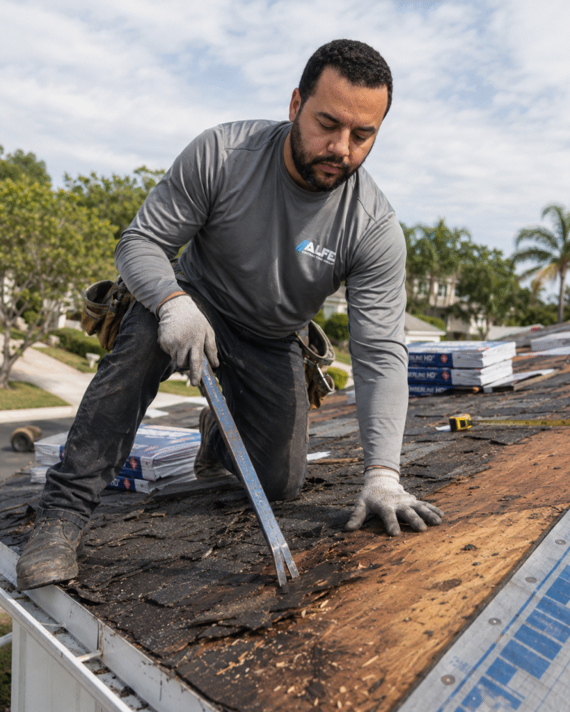 Alfe Construction contractor performing a complete roof replacement on a residential home in Orlando, Central Florida