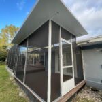Completed screen room over a rebuilt deck with solid roof (after)