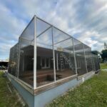 Aluminum screen enclosure frame installed over a deck (in progress)