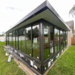 Floor-to-ceiling glass sunroom with black frame built by ALFE in Central Florida