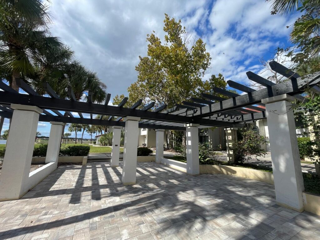 Custom pergola rebuilt by ALFE over a paver walkway in Central Florida